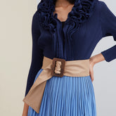 Model in blue sleeveless dress.